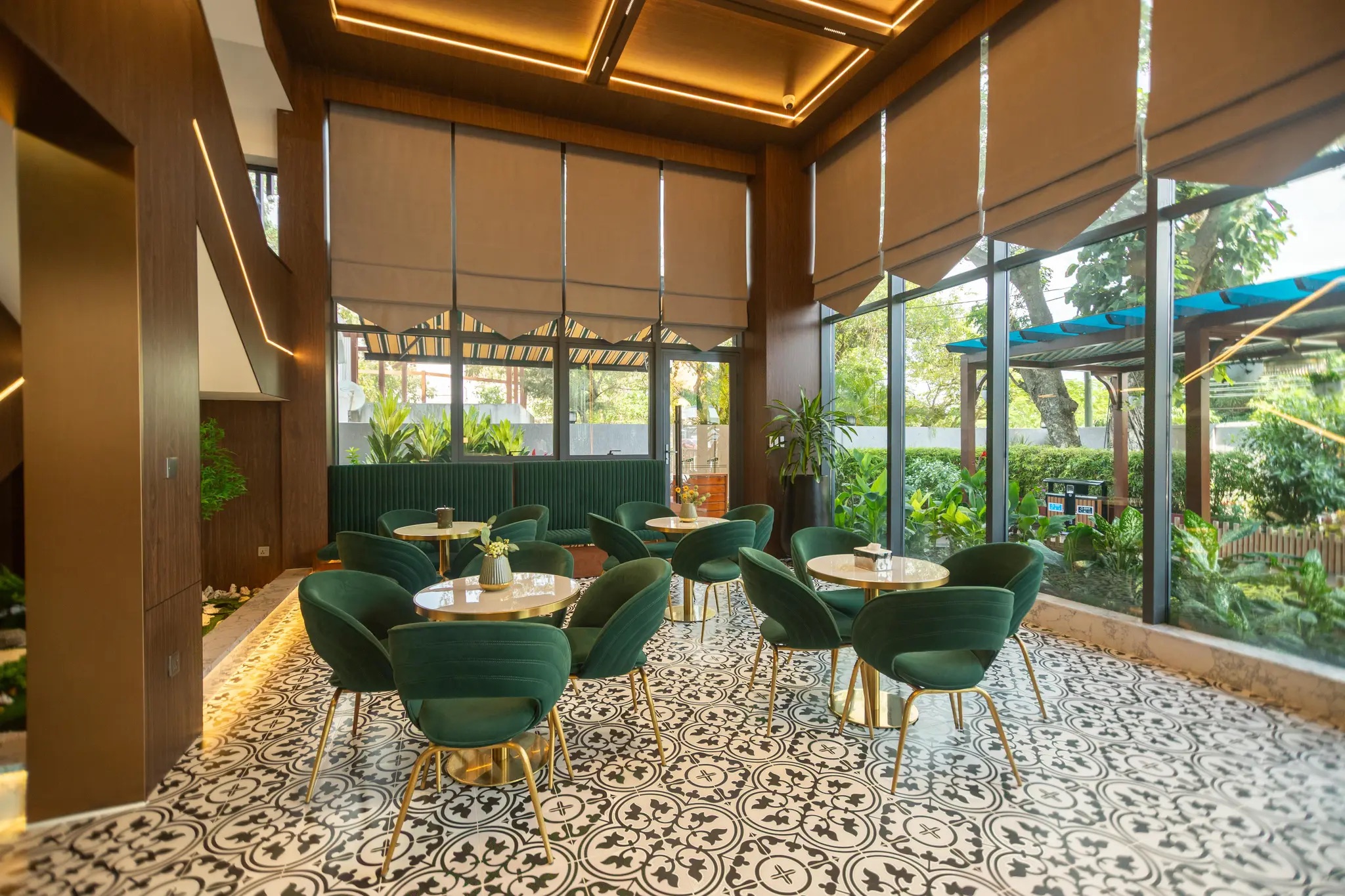 ESP Hotel lounge with garden views and green velvet seating